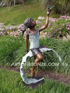 Enchanted Butterfly fantasy bronze sculpture of girl sitting on giant leaf with butterfly