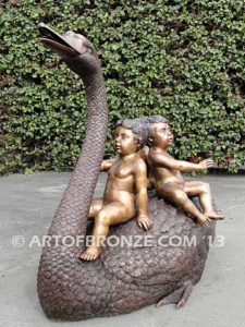 Fantasy bronze sculpture of playing cherubs on graceful swan