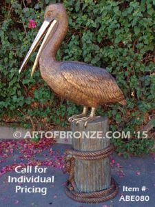 Pelican Pilings bronze statue of playful pelicans on bronze pilings