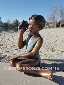 Ocean Sounds bronze sculpture for pool, garden or yard of young child holding conch shell