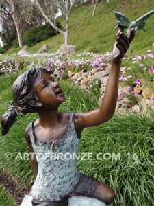 Enchanted Butterfly fantasy bronze sculpture of girl sitting on giant leaf with butterfly