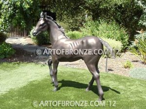 Prancing Delight sculpture of foal with flowing mane and tail with strong muscle details