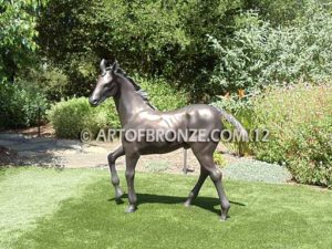 Prancing Delight sculpture of foal with flowing mane and tail with strong muscle details