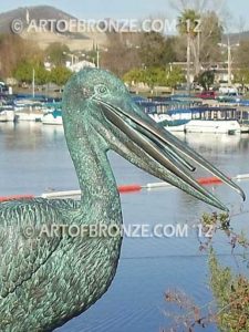 Fisherman bronze statue of tranquil pelican on bronze piling