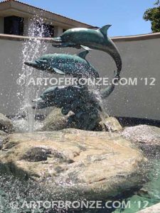 Soul Surfers marine life bronze cast three dolphin sculpture monument