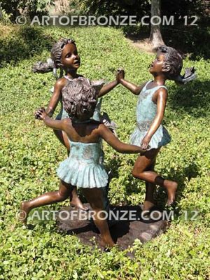 Ring Around fountain sculpture of three girls holding hands and dancing around