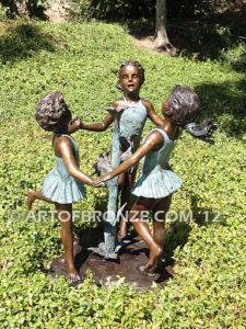 Ring Around fountain sculpture of three girls holding hands and dancing around