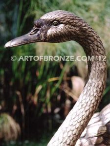 Swan Lake outdoor life-size garden statue of swan and playing cygnets