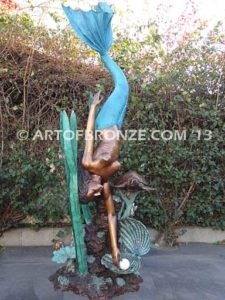Bronze mermaid fine art sculpture holding oyster shell for pond, pool or aquatic display