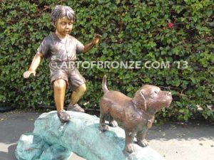 Adventurous Pals Bronze monumental sculpture for garden or yard of boy and dog crossing bronze log