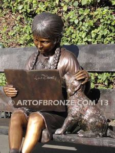 Love and Affection sculpture of young reader girl with dog and book