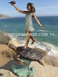 A Treasured Day Bronze sculpture of whimsical girl on turtle playing with seashell