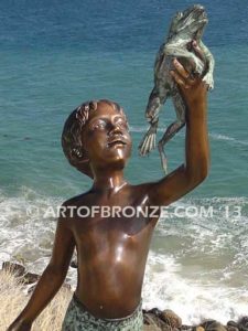 A Day to Remember Bronze sculpture of whimsical boy on turtle holding bucket of bullfrogs