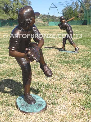 Championship Game bronze baseball player statues featuring a boy pitching and hitting