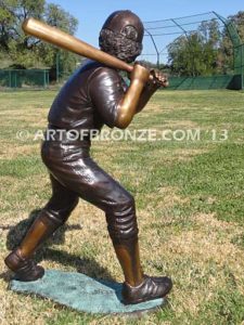 Home Run bronze sculpture of boy playing baseball hitting ball