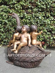 Fantasy bronze sculpture of playing cherubs on graceful swan
