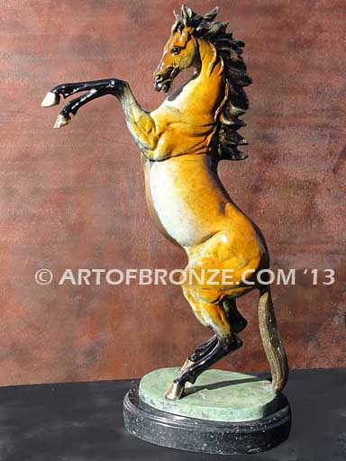 - Sunfire sculpture of reared horse with contemporary brilliant patina coloring attached to marble base