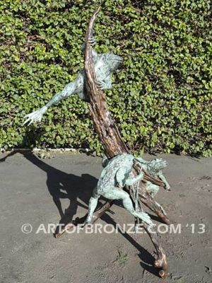 Playground three bronze bullfrogs playing on branches for garden or outdoor display