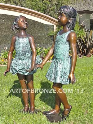 Dance Partners bronze sculpture of two ballerinas holding hands