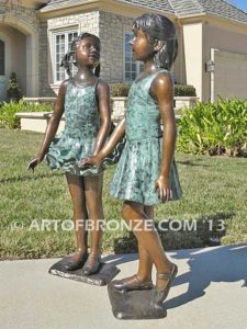 Dance Partners bronze sculpture of two ballerinas holding hands