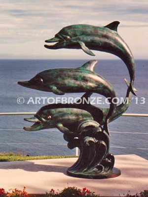 Soul Surfers marine life bronze cast three dolphin sculpture monument