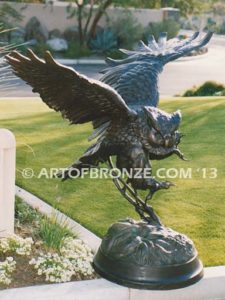 Owl lost wax casting of magnificent and powerful owl hunting on brick pedestal