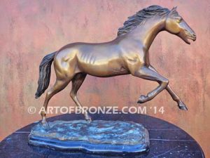 Running Free sculpture award of charging horse attached to a marble base