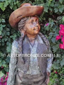 Wild West Spirit bronze sculpture of western cowgirl wearing a Stetson and holding a rope