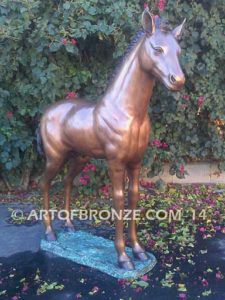 Precious bronze sculpture of standing foal, filly, colt and yearling horse for ranch or equestrian center
