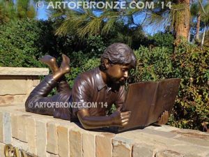 Best in His Class bronze sculpture of young boy reading his favorite novel