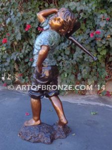 Strolling Along bronze sculpture of boy helping in garden watering flowers