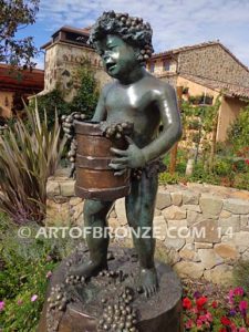 Harvest Time bronze sculpture of cherub boy standing on wine barrel with grapes