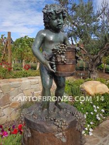 Harvest Time bronze sculpture of cherub boy standing on wine barrel with grapes