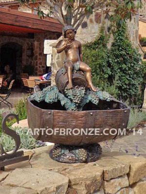 Special Reserve bronze sculpture fountain of cherub sitting on wine barrel