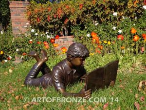 Best in His Class bronze sculpture of young boy reading his favorite novel