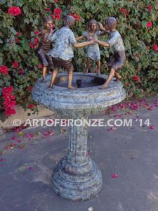 Playground Joy bronze fountain sculpture of kids dancing around