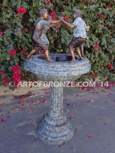 Playground Joy bronze fountain sculpture of kids dancing around