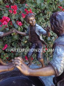 Playground Joy bronze fountain sculpture of kids dancing around