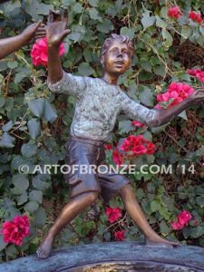 Playground Joy bronze fountain sculpture of kids dancing around