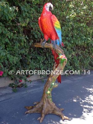 Scarlet Macaw outdoor statue of life-size wild Macaw on a branch