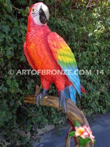 Scarlet Macaw outdoor statue of life-size wild Macaw on a branch