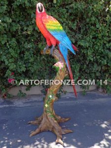 Scarlet Macaw outdoor statue of life-size wild Macaw on a branch