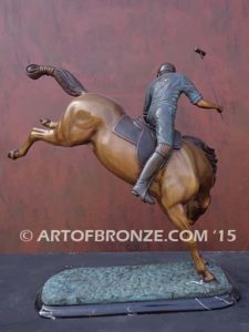 Change of Direction sculpture of polo player riding his leaping polo pony attached to a marble base