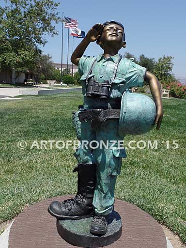 Home of the Brave bronze sculpture of saluting boy dressed up playing soldier