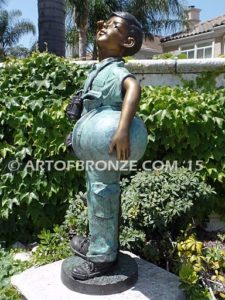 Home of the Brave bronze sculpture of saluting boy dressed up playing soldier