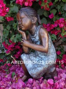 Cutie Pie bronze statue of girl relaxing in a daydream