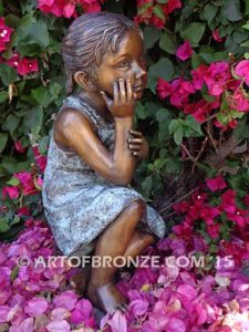 Cutie Pie bronze statue of girl relaxing in a daydream