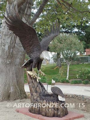 Dinner for Two* statue of a life-size bald eagle feeding its baby eaglet in nest