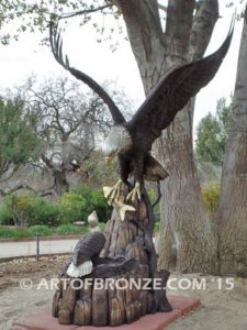 Dinner for Two* statue of a life-size bald eagle feeding its baby eaglet in nest