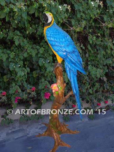 Blue and Gold Macaw statue of life-size wild Macaw on a branch